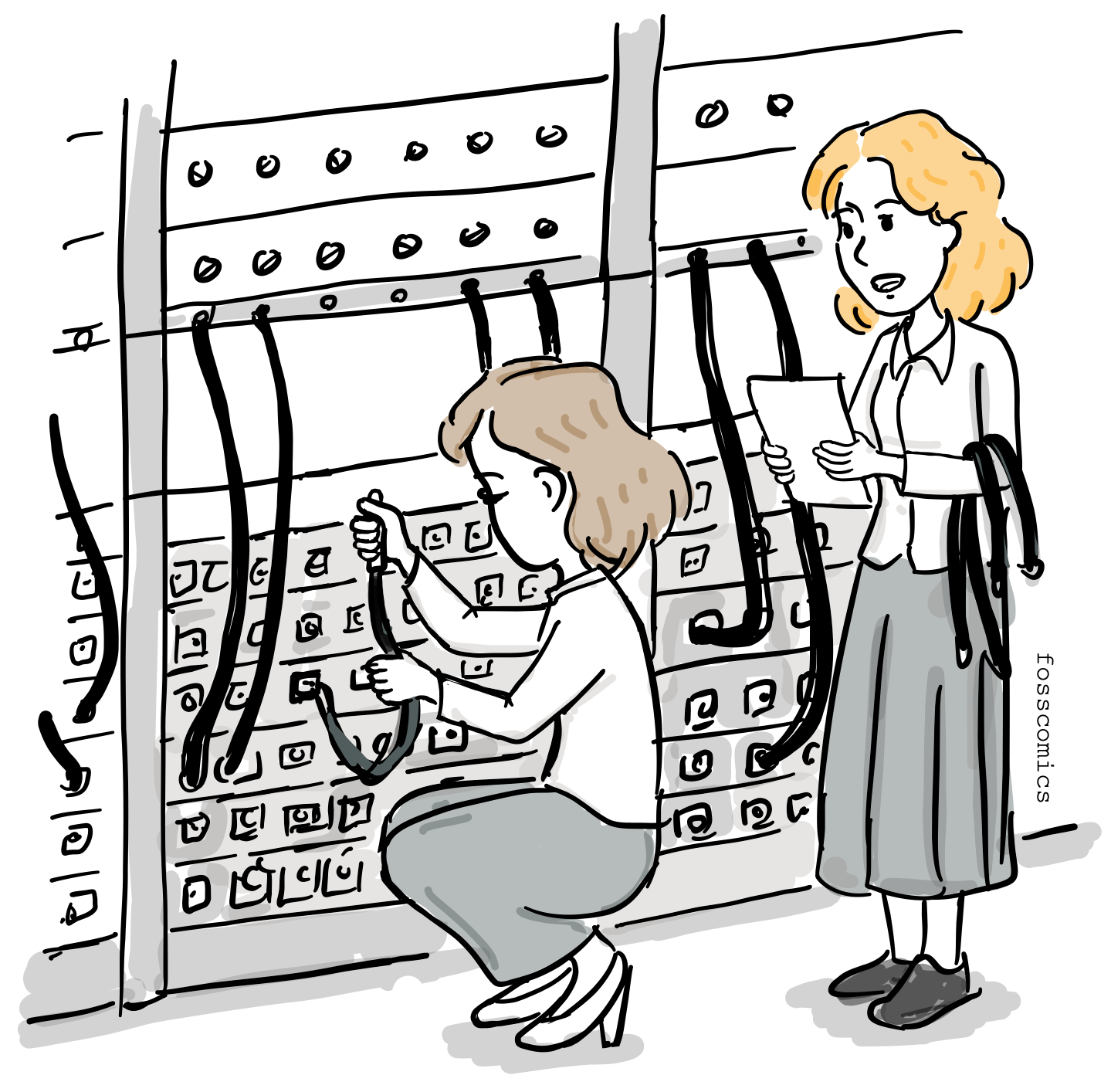 Two women technicians are programming in front of an ENIAC computer