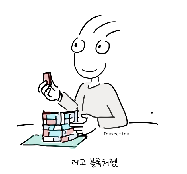 발표자가 색색의 장난감 블록을 연결해 더 큰 구조물을 만든다.