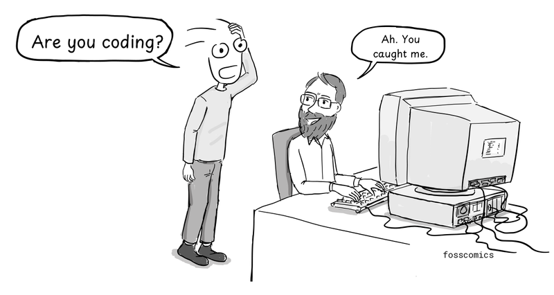 A colleague approaches Ritchie at his computer.