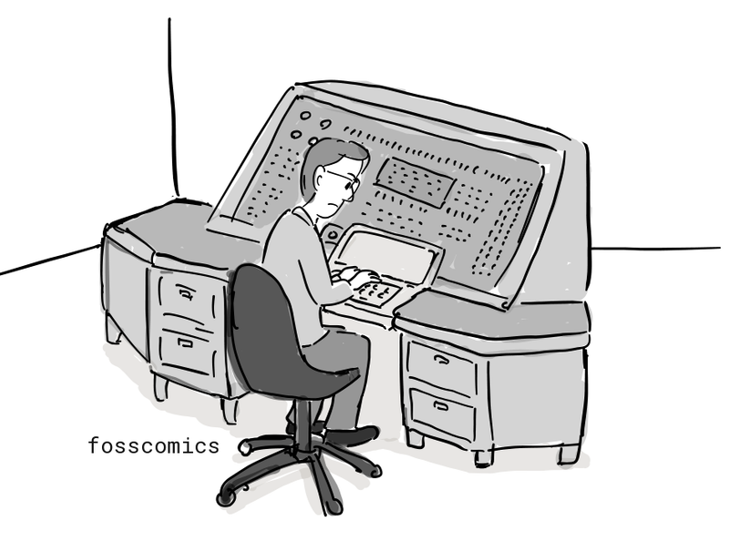 Dennis works at a large computer.