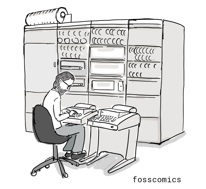 A young Ritchie works at a large computer.