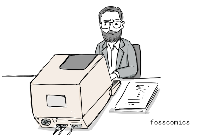 Brian Kernighan writes at a computer.