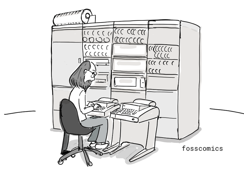 A researcher works at a large computer.