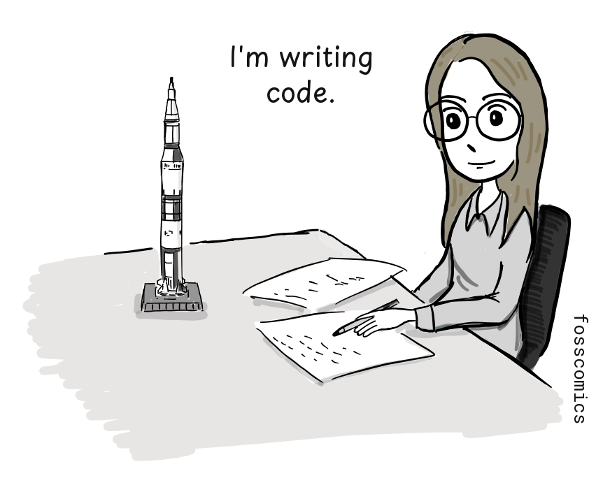 A programmer writes code on paper at a desk beside a model rocket.