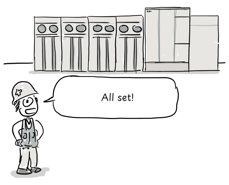 An installer stands beside a room-sized mainframe.