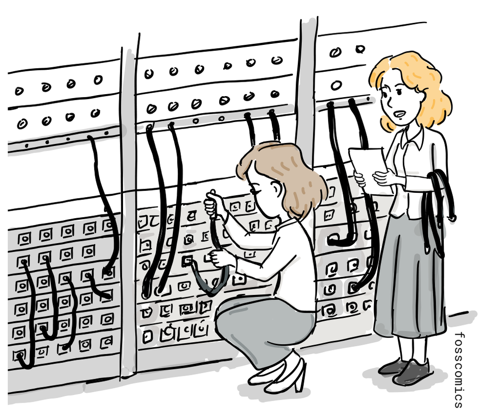 Two women program ENIAC by connecting cables on its control panels, with one reading from a sheet of notes.
