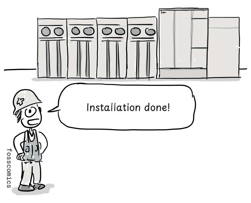 An installer stands beside a room-sized mainframe.