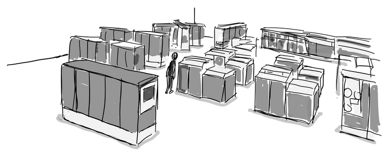 A person stands among rows of large computer cabinets in a Multics machine room.