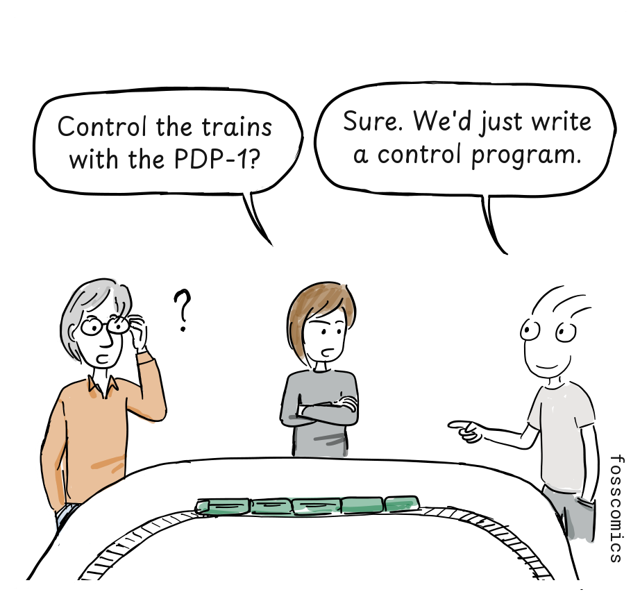 One club member reacts with surprise as another proposes writing a PDP-1 control program.