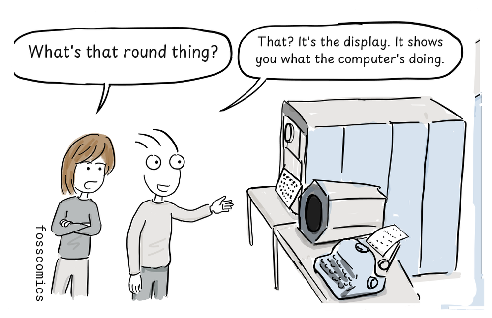 A club member points out the PDP-1's round display while another looks puzzled.