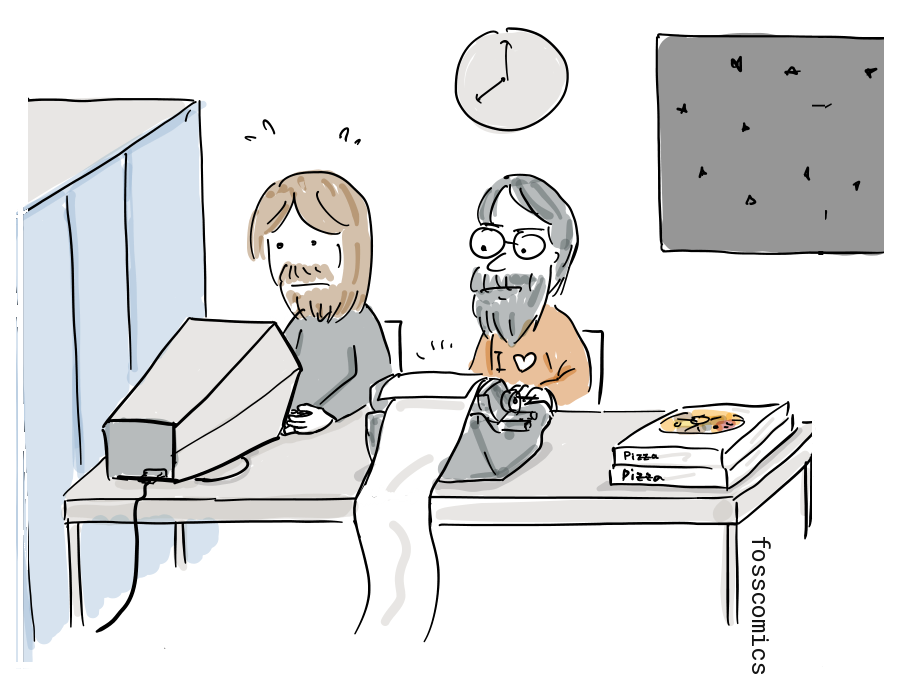 Two programmers work at the PDP-1 late at night beside a stack of pizza boxes.