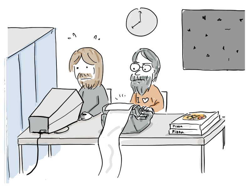 Two programmers work at the PDP-1 late at night beside a stack of pizza boxes.