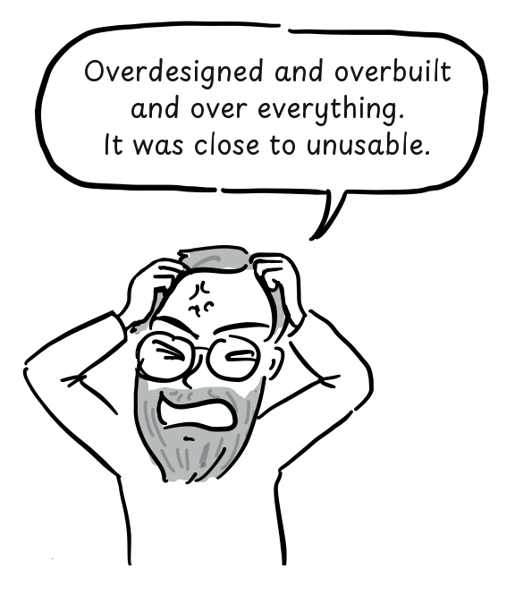 A frustrated programmer grips his hair while criticizing the complexity of Multics.