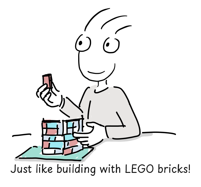 The presenter connects colorful toy bricks into a larger structure.